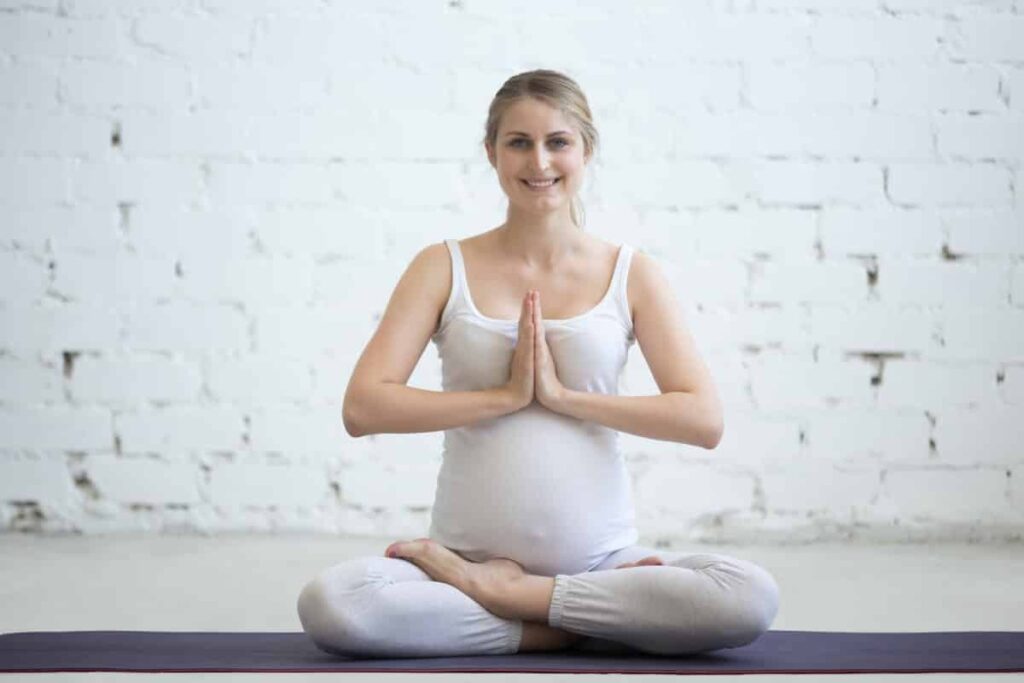 Duis sagitis ipsum prasent Pregnant Young Woman Sitting Prenatal Yoga Prayer Position 1 1024x683